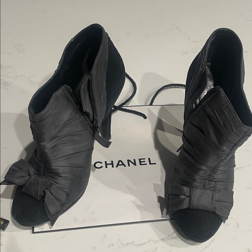 CHANEL Black Heeled Boots with Bow Accent